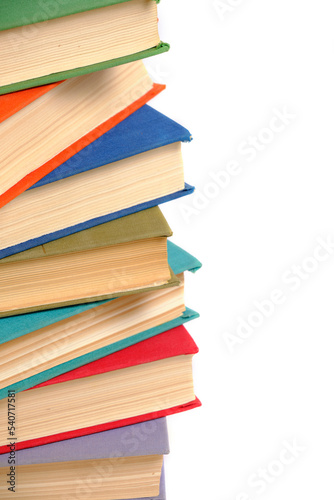 Bunch old battered multicolored hardcover books white background.