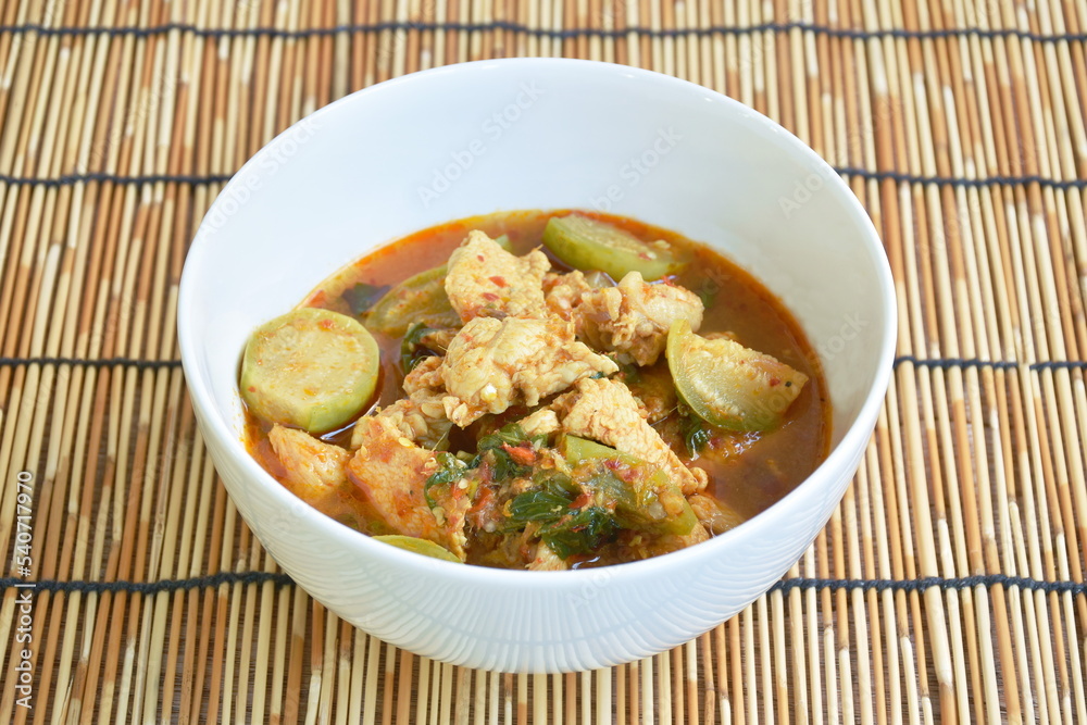 spicy boiled chicken with eggplant in curry soup on bowl spicy boiled chicken with eggplant in curry soup on bowl