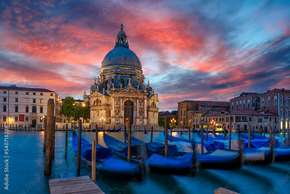 Canal Grande with Venice gondola and Basilica di Santa Maria della Salute in Venice, Italy