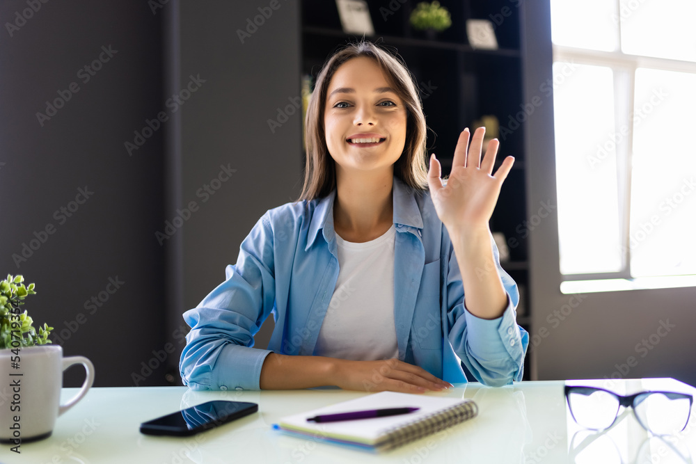 Young woman using video chat indoors, view from web camera at office Young woman using video chat indoors, view from web camera at office