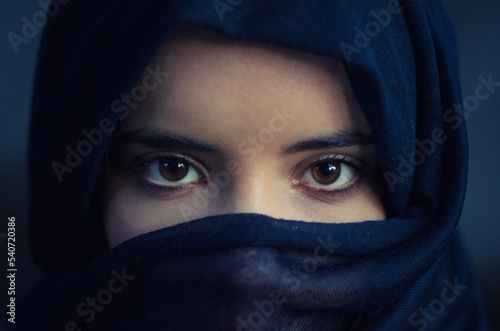 Portrait of the beautiful muslim woman in hijab showing her face and eyes