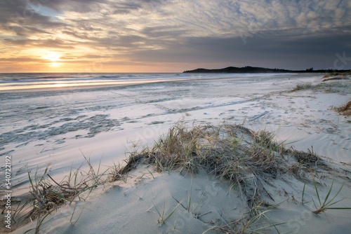 Airforce Beach sand in Evans Head, Australia during sunset
