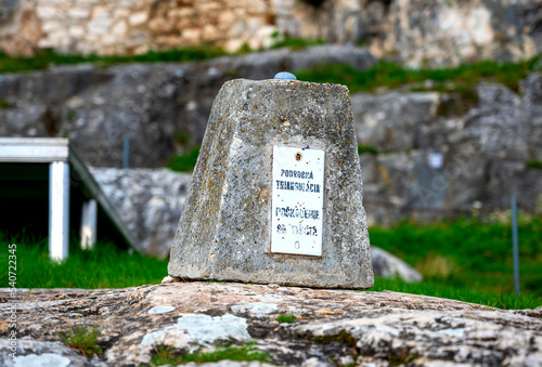 old triangulation point on a stone at the Spiš Castle in Slovakia