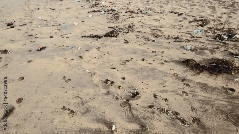 Pov walk through a beach full of garbage waste. Plastic pollution and environmental problem concept. garbage pollution beach. Ecology catastrophe. World disaster.