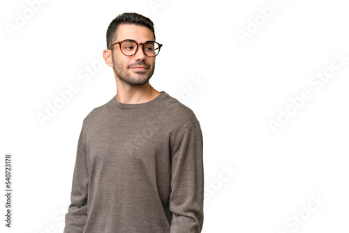 Young handsome caucasian man over isolated background . Portrait © luismolinero