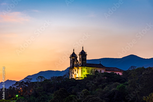 Historic church in baroque style on top of the mountain in Ouro Preto city in Minas Gerais during sunset © Fred Pinheiro