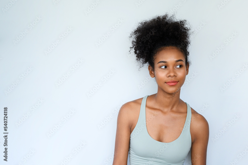 Beautiful young African American girl posing with fitness clothes isolated over white background. Healthy and Fitness concept. Beautiful young African American girl posing with fitness clothes isolated over white background. Healthy and Fitness concept.