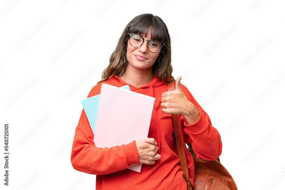 Young student caucasian woman over isolated background giving a thumbs up gesture - obrazy, fototapety, plakaty 