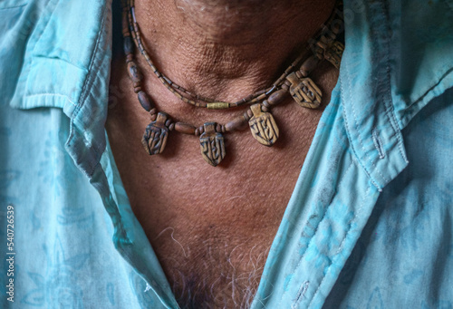 Garland of tulsi in the neck of a senior man 
