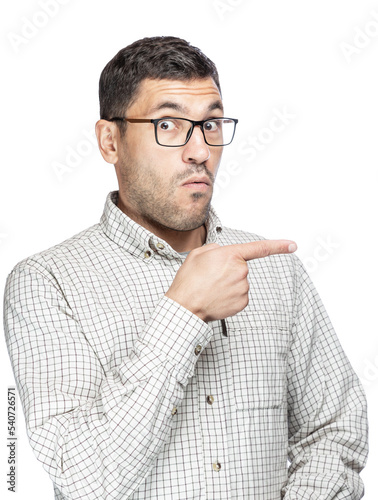 Handsome man with glasses and a plaid shirt, pointing at something from the side photo