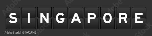 Black color analog flip board with word singapore on gray background