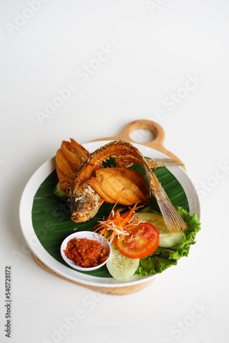 Gurame Goreng Terbang or fried gurami with javanese special sambal photo