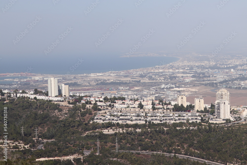 the cityscape of haifa city with the surrounding neighboring cities of akko and krayoot and the mediterranean sea the cityscape of haifa city with the surrounding neighboring cities of akko and krayoot and the mediterranean sea
