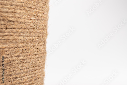 close-up of brown jute twine for DIY and gift wrapping, isolated on white background, concept of zero waste or sustainable lifestyle.