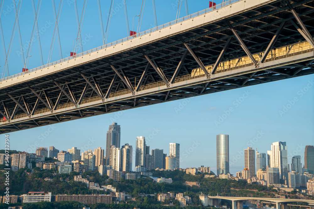 Naklejka premium Rail bridge and urban skyline, Chongqing, China