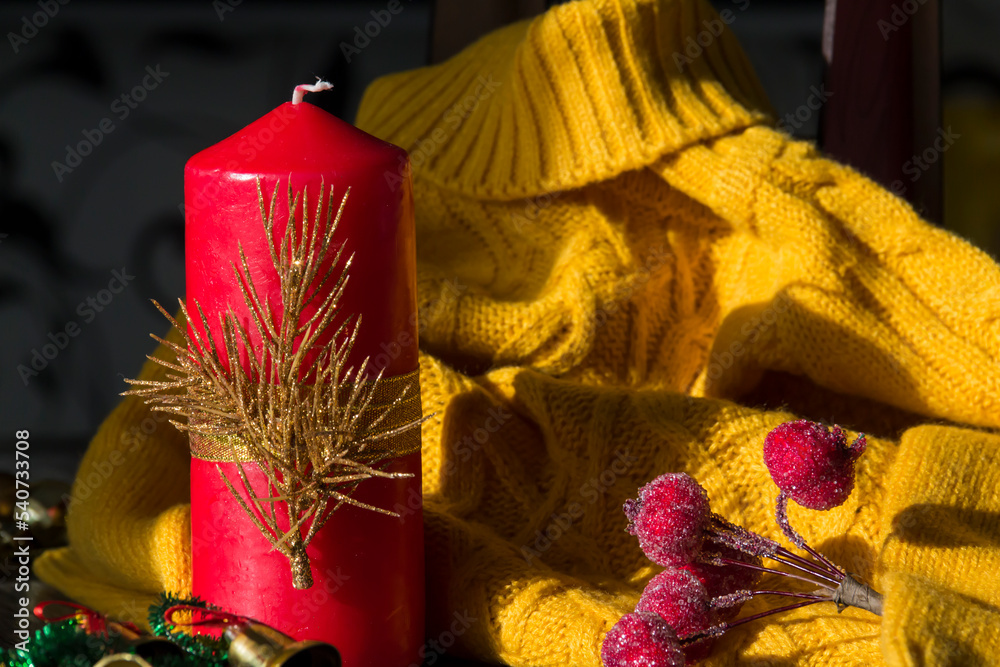 New Year and Christmas decorations and decorations with a yellow sweater on a wooden surface background. Preparation for the holiday.