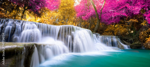 Amazing in nature  beautiful waterfall at colorful autumn forest in fall season 