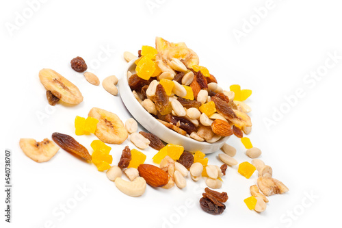 Fruit and nut assortment of peanuts, raisins, pineapple, almonds, cashews and bananas.