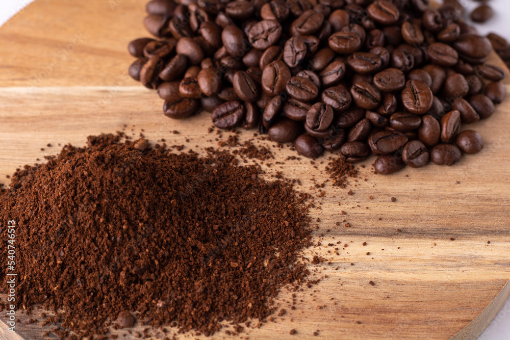 coffee piles of coffee beans on a wooden board