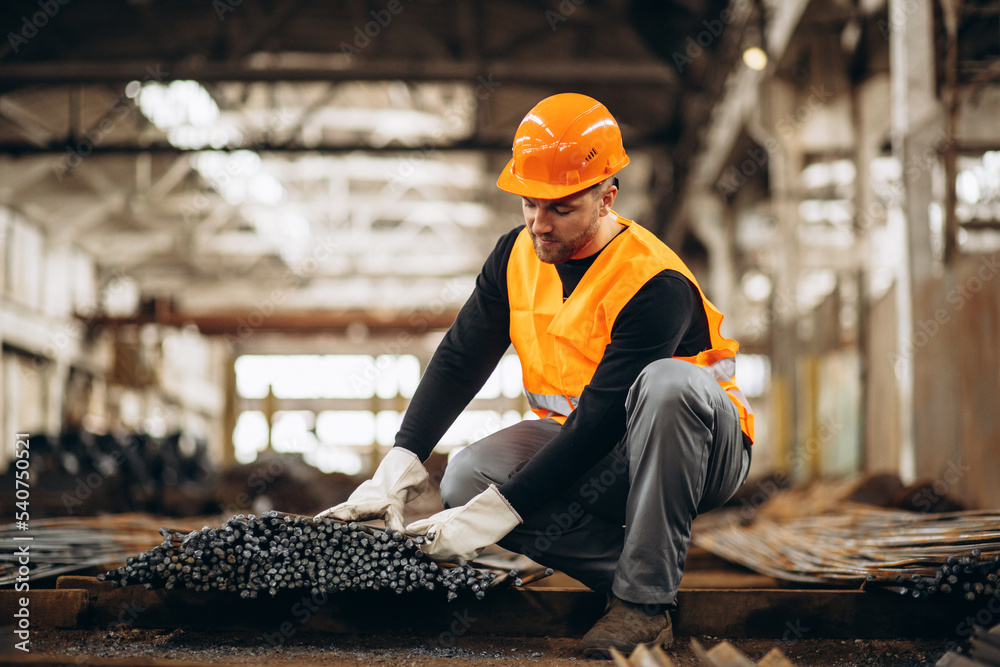 Man worker at a steel factory