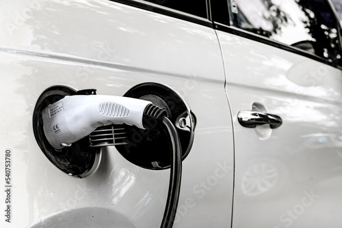 Fotografie Electric car at the charging station