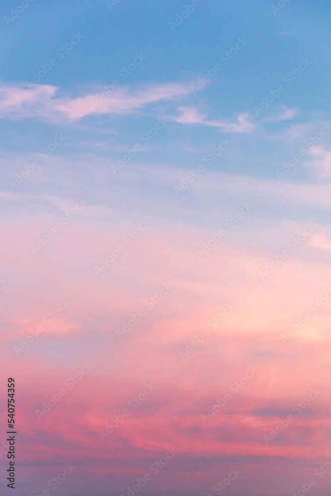 Sunset sky with blue to pink gradient color and clouds