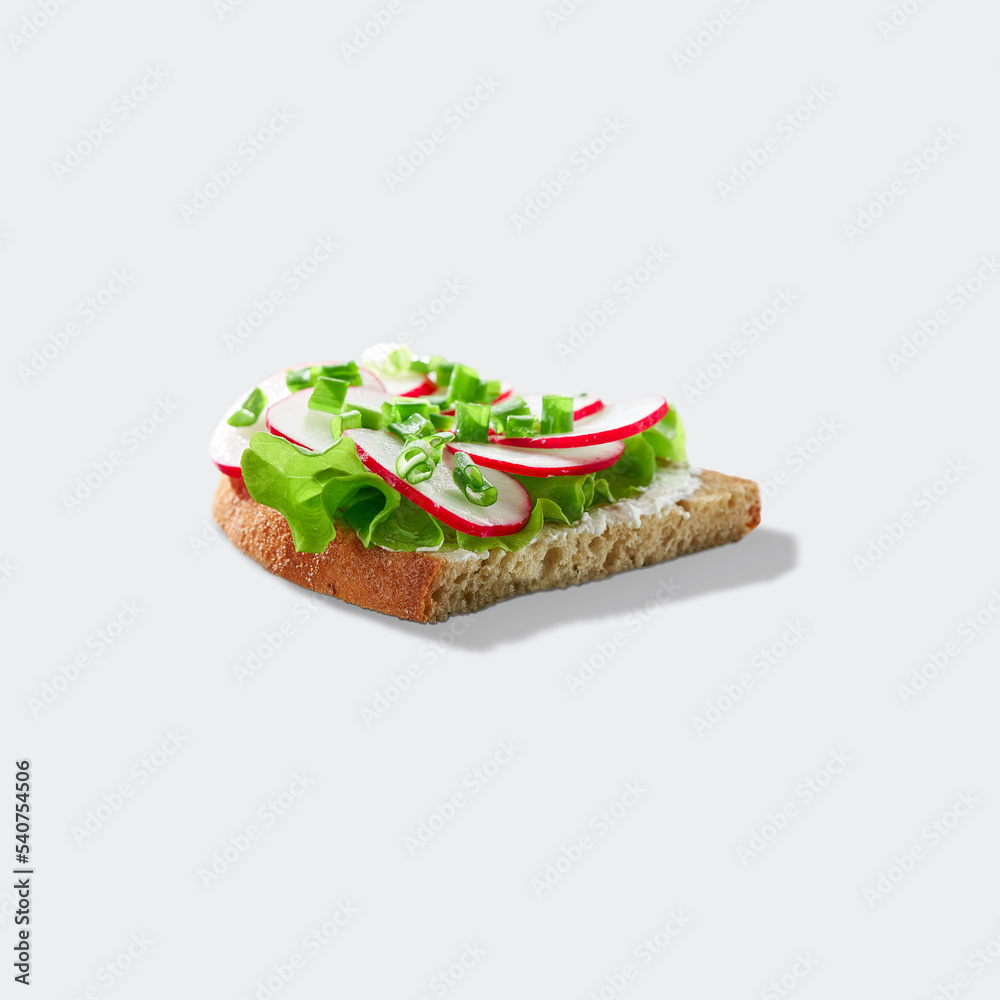 The concept of a healthy Breakfast for two. Sandwich with cottage cheese, radish, green onions and lettuce. Sandwich isolated on a white background.