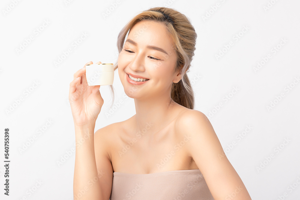 © Shutter B - Happy beautiful young asian woman holding cosmetic cream blank bottle, Fashion model, Health wellness, Beautiful girl skin care and facial treatment. Isolated on white background. © Shutter B - Happy beautiful young asian woman holding cosmetic cream blank bottle, Fashion model, Health wellness, Beautiful girl skin care and facial treatment. Isolated on white background.
