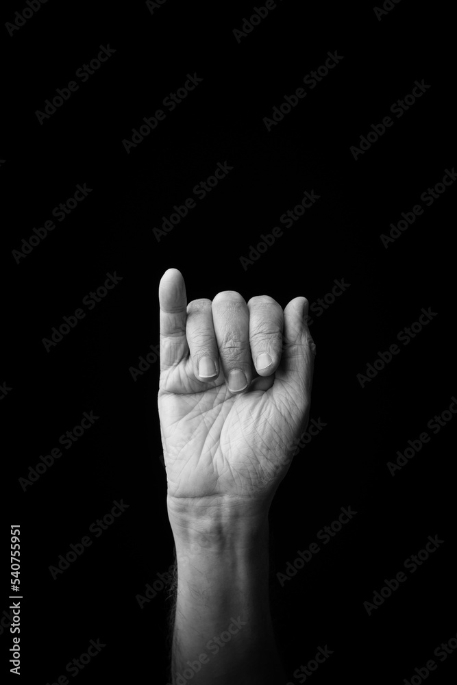 Hand demonstrating the Japanese sign language letter 'I' or 'ぃ' with copy space Hand demonstrating the Japanese sign language letter 'I' or 'ぃ' with copy space