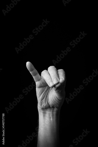 Hand demonstrating the Japanese sign language letter 'CHI' or 'ち' with copy space