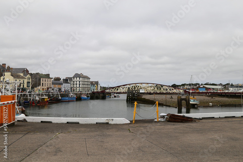 A view of the harbour and fishing boats on a grey summer's day in Ramsey, Isle of Man. photo