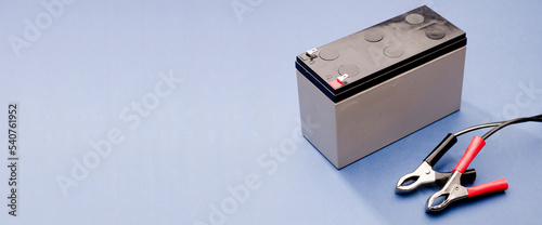Obraz na plátně red and black connection pins with battery positive pole and negative pole, blue