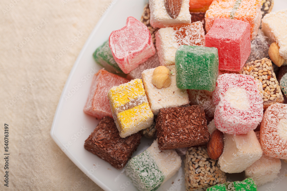 A variety of colored Arabic and Turkish sweets on a plate A variety of colored Arabic and Turkish sweets on a plate