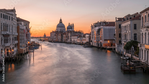 Sunrise  over the Grand Canal, in Venice, Italy, looking towards the majestic Basilica di Santa Maria della Salute. Long exposure to smooth out the water