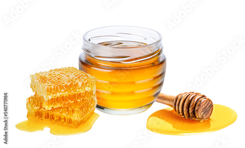 Honey isolated on white or transparent background. Jar with honey, honeycomb and honey dipper.