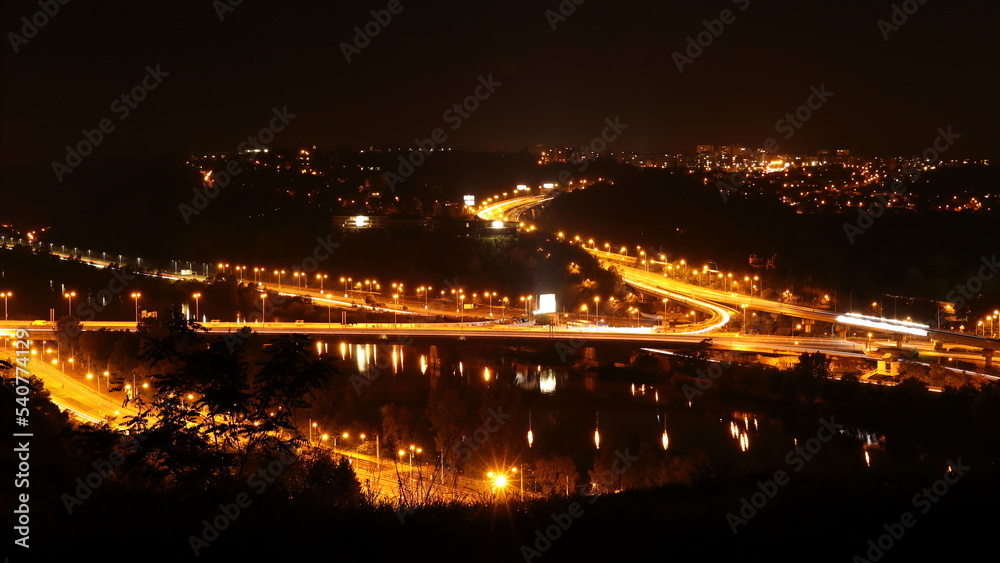 Night-lit large intersection on the highway ring, Barrandovsk most in Prague