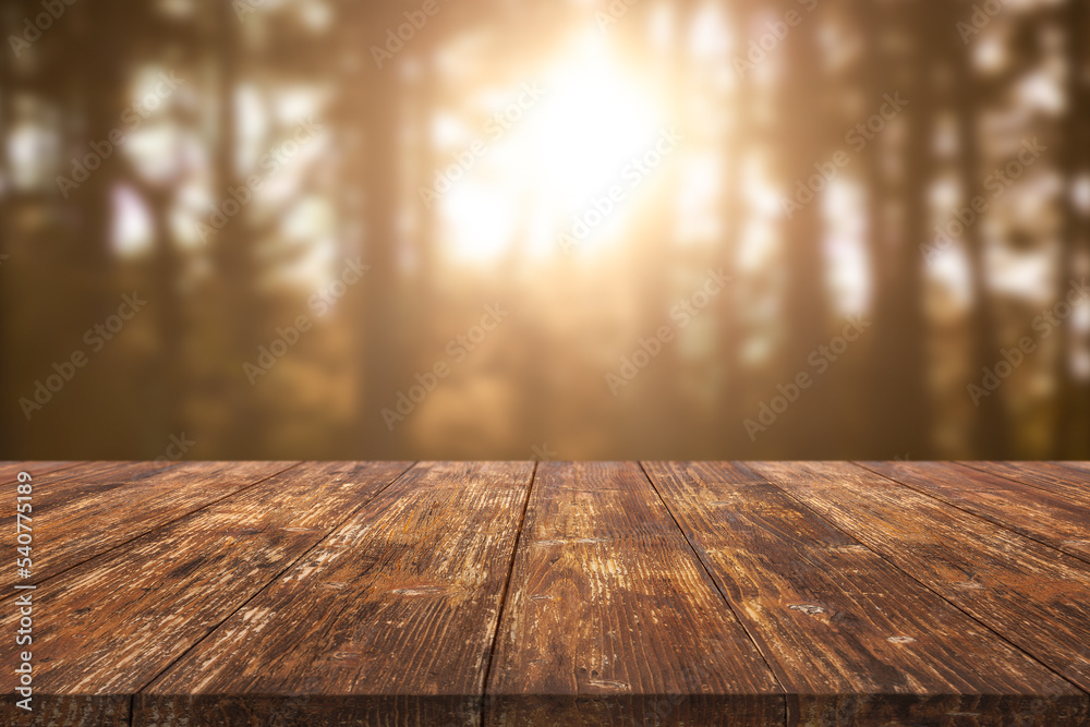 Wooden table on a natural blurred background Wooden table on a natural blurred background
