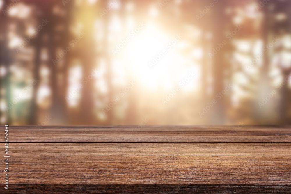Wooden table on a natural blurred background Wooden table on a natural blurred background