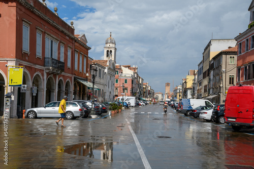 Chioggia 03 - il centro città dopo la pioggia, con colori vivi e riflessi sulla strada. photo