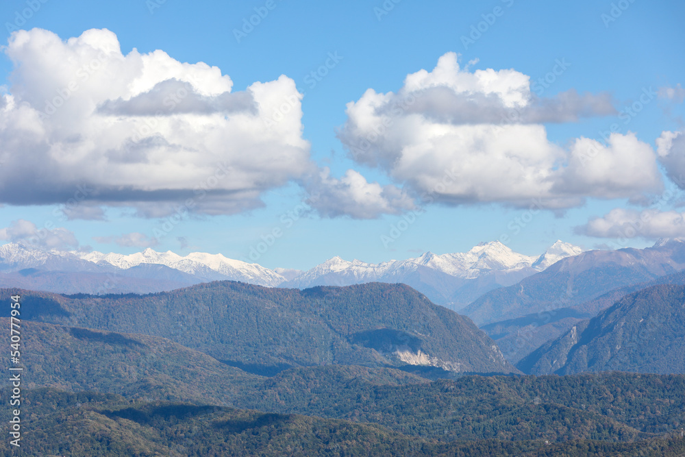 Mountains and snow peaks under beautiful clouds. The Caucasian ridge. Mountains and snow peaks under beautiful clouds. The Caucasian ridge.