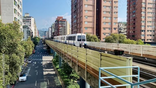 A mass rapid transit train is leaving station. The  metro system is one of the main means of transportation for Taipei citizens in Taiwan.