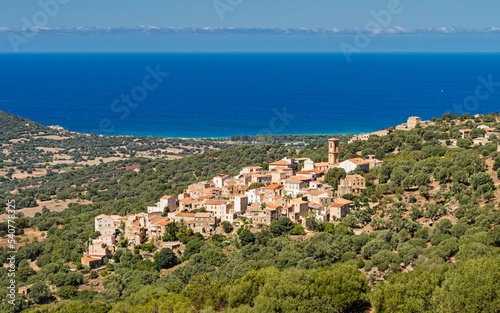 The mountain village of Aregno in Balagne region of Corsica with Mediterranean sea in the distance, Corsica, France