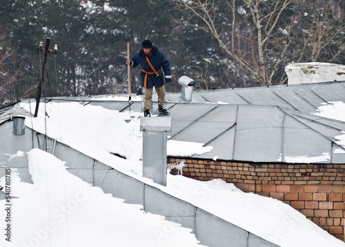 snow remover works on rooftop