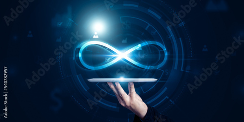 Businessman with infinity symbol projection from tablets device technology, future finance unlimited infinite resource power supply internet data information usage vector illustration blue background