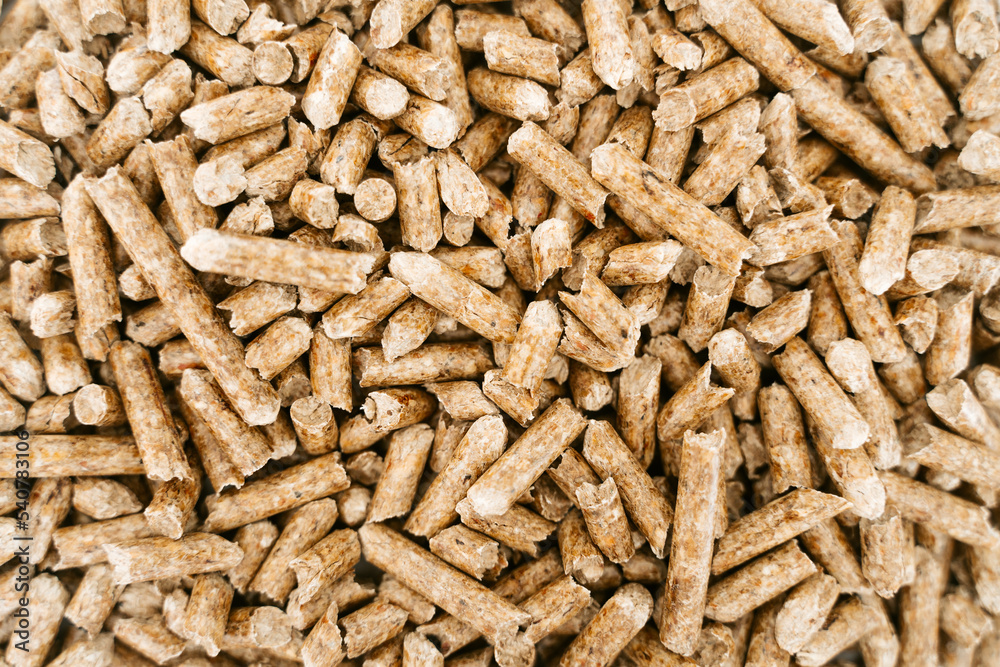 Biofuels. Alternative biofuel from sawdust. Wood pellets background. The cat litter. Biofuels. Alternative biofuel from sawdust. Wood pellets background. The cat litter.