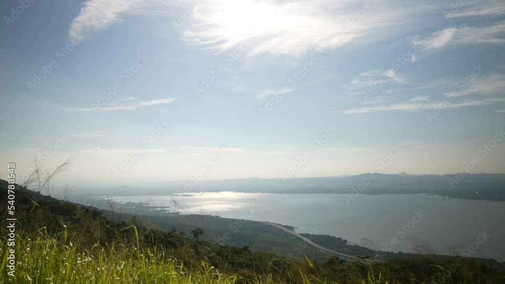 View nature of hill and river on blue sky on sunny background of slow motion View nature of hill and river on blue sky on sunny background of slow motion
