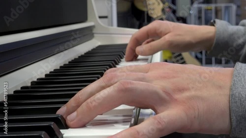 The pianist plays the piano, the pianist's hands, close-up