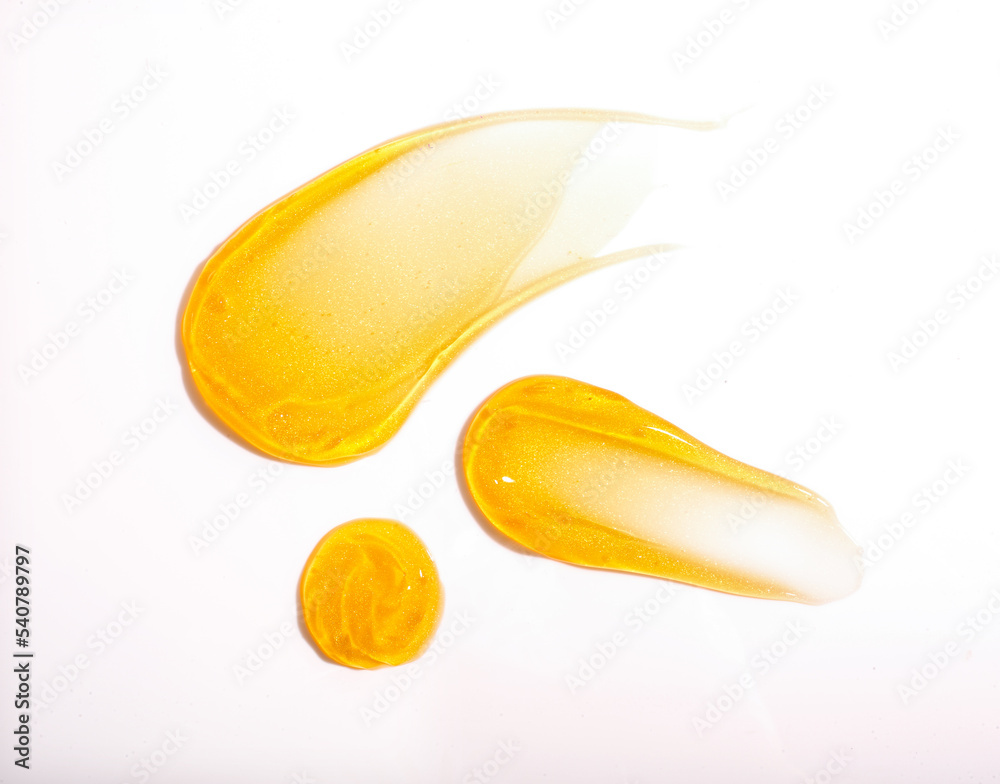 Gold skincare texture swatches. Golden swatch on white background. Gold skincare texture swatches. Golden swatch on white background.