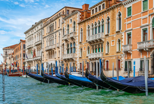 Gondolas moored on Grand Canal at traditional Venetian buildings, Venice, Italy. © Nancy Pauwels