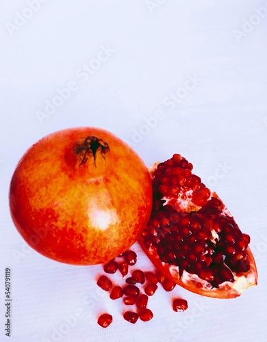 Pomegranate (Punica granatum) fruit whole and cut red anaar rodie nar melograno anor grenadefruit anar delima granateple granatapfel frantafruit shiliufruit dalimafruit view image photo
 photo